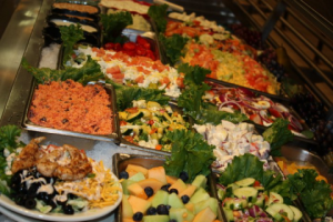 C&H Cafeteria steam table line with fresh salads and vegetables