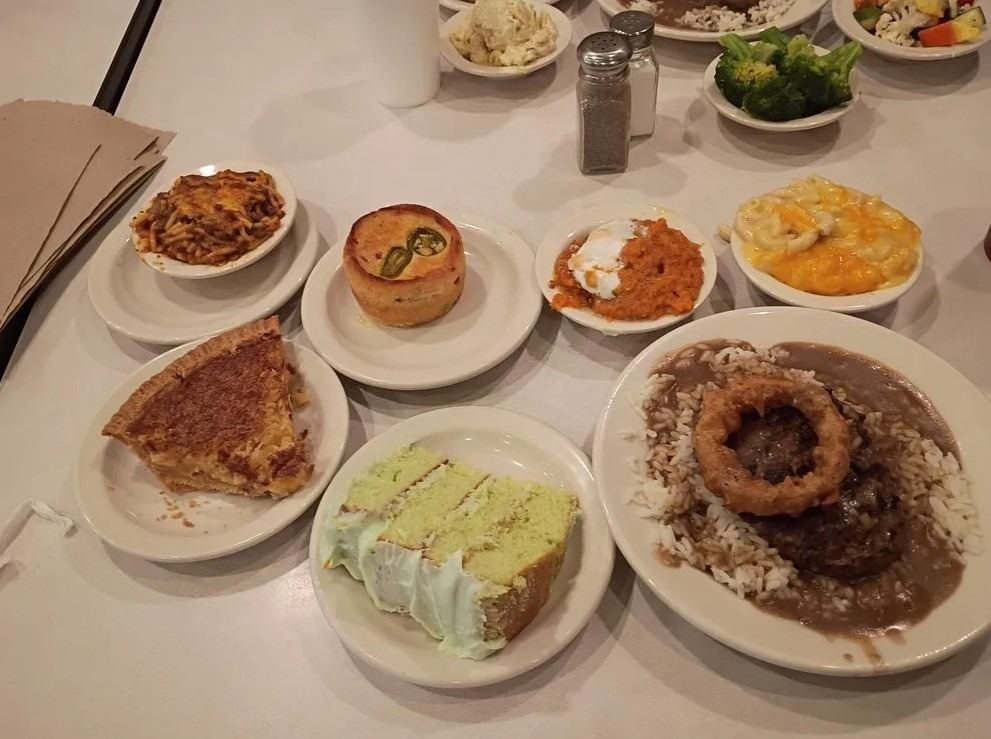 Sampler plate of C&H Cafeteria homestyle dishes including pie, cake and grilled chicken