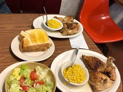 Grilled chicken plate with salad and corn